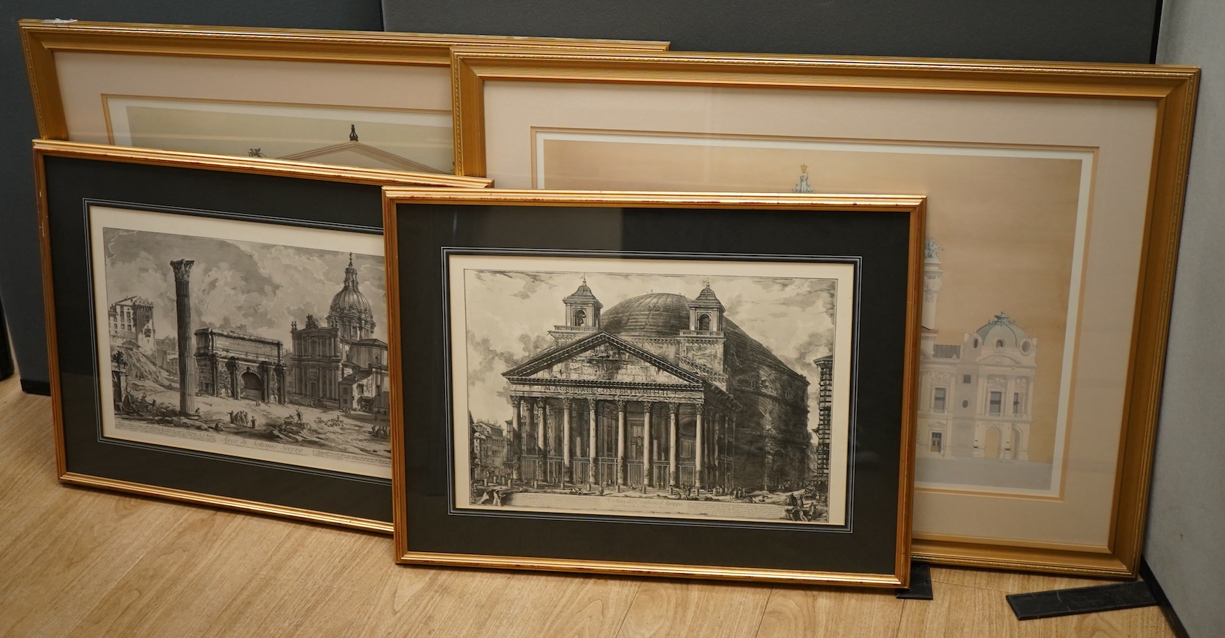 A pair of modern architectural colour prints together with a pair of decorative prints after Piranesi to include: Arco Di Settimio Severo, largest 48 x 73cm, all framed